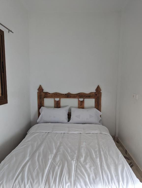 Postel nebo postele na pokoji v ubytování darna surf house anza