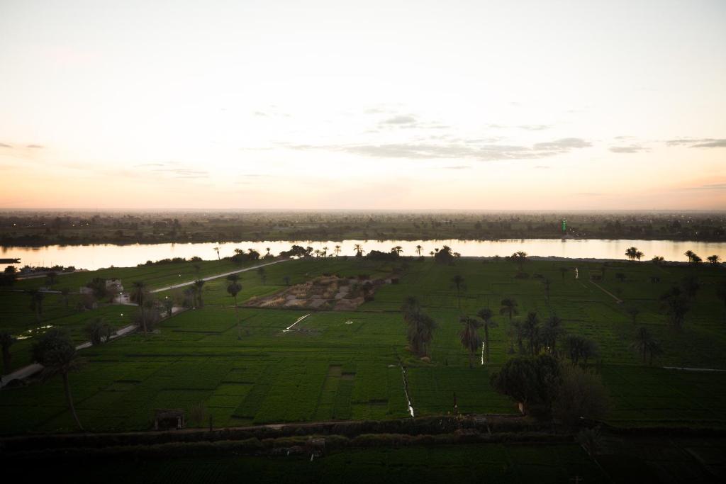 an aerial view of a park next to a lake at Holy Family Hotel in Jabal aţ Ţayr