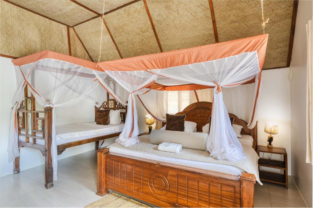 Postel nebo postele na pokoji v ubytování Cinnamon Hotel