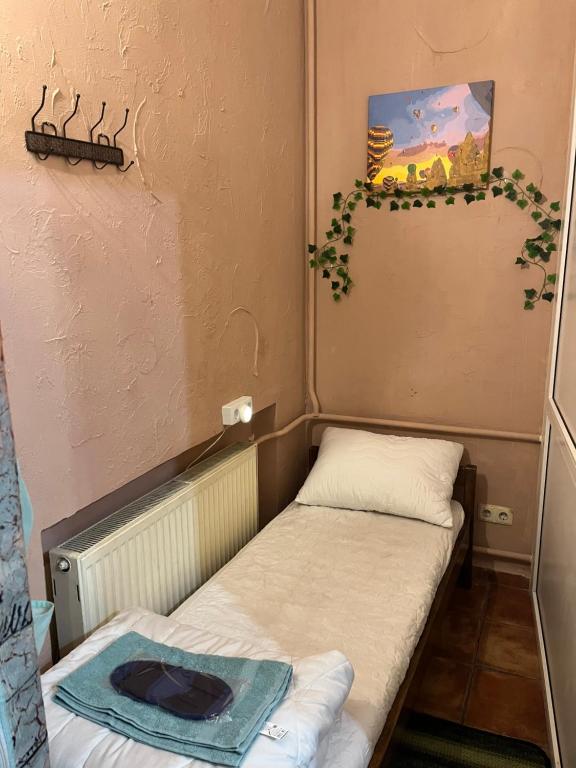 Postel nebo postele na pokoji v ubytování ArArAt-PODOL Hostel KYIV