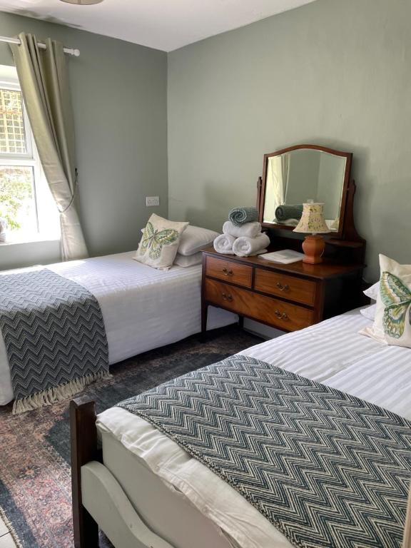 Voodi või voodid majutusasutuse Kate's Cottage toas