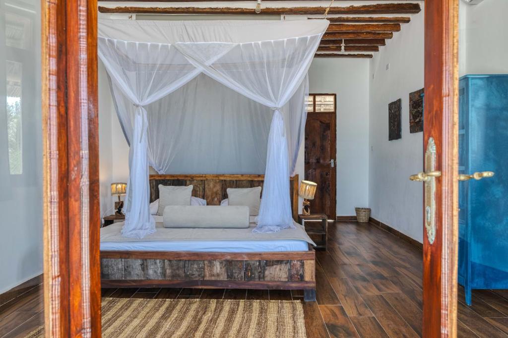 Postel nebo postele na pokoji v ubytování Cinnamon Hotel