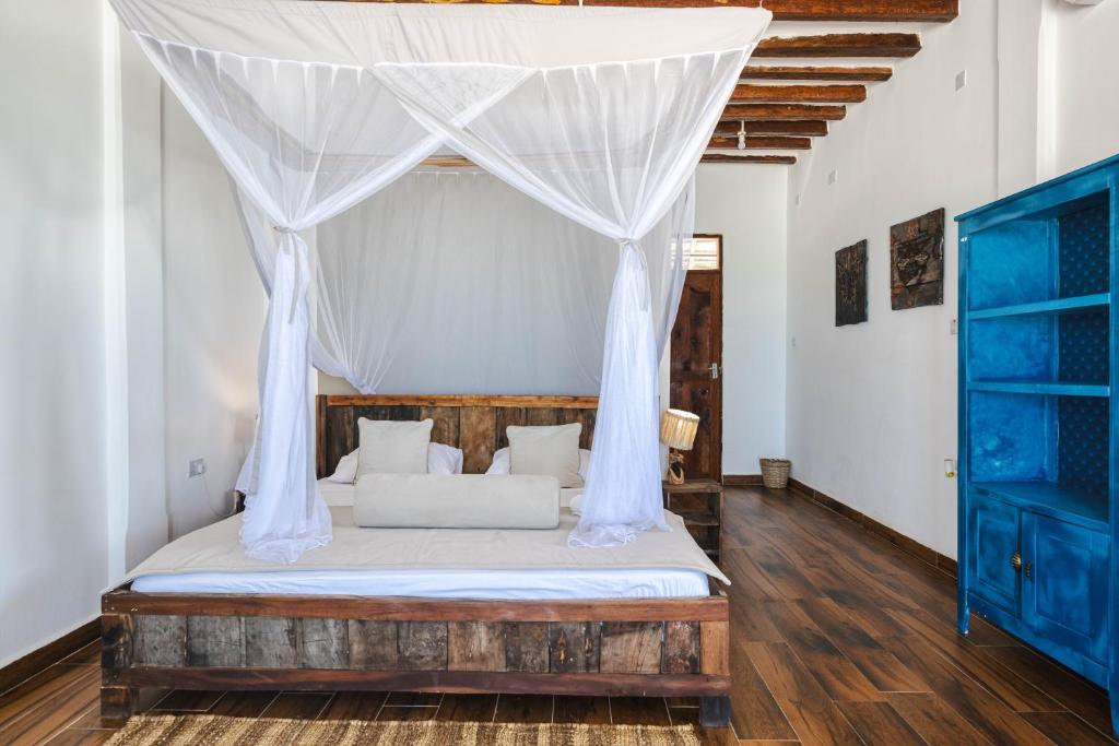 Postel nebo postele na pokoji v ubytování Cinnamon Hotel