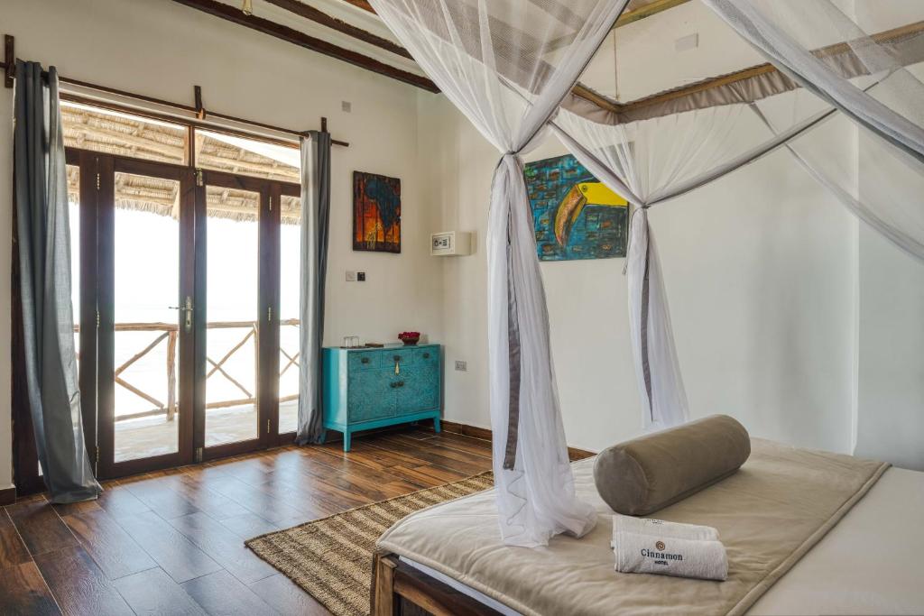 Postel nebo postele na pokoji v ubytování Cinnamon Hotel