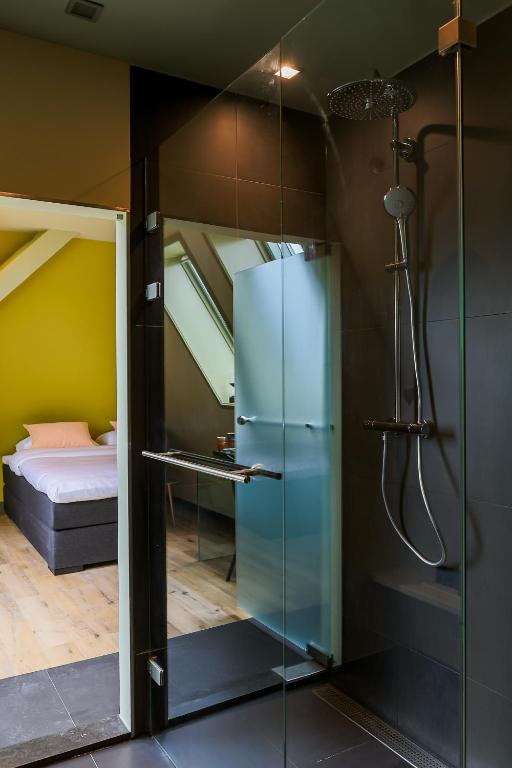 Postel nebo postele na pokoji v ubytování Hotel Corps de Garde