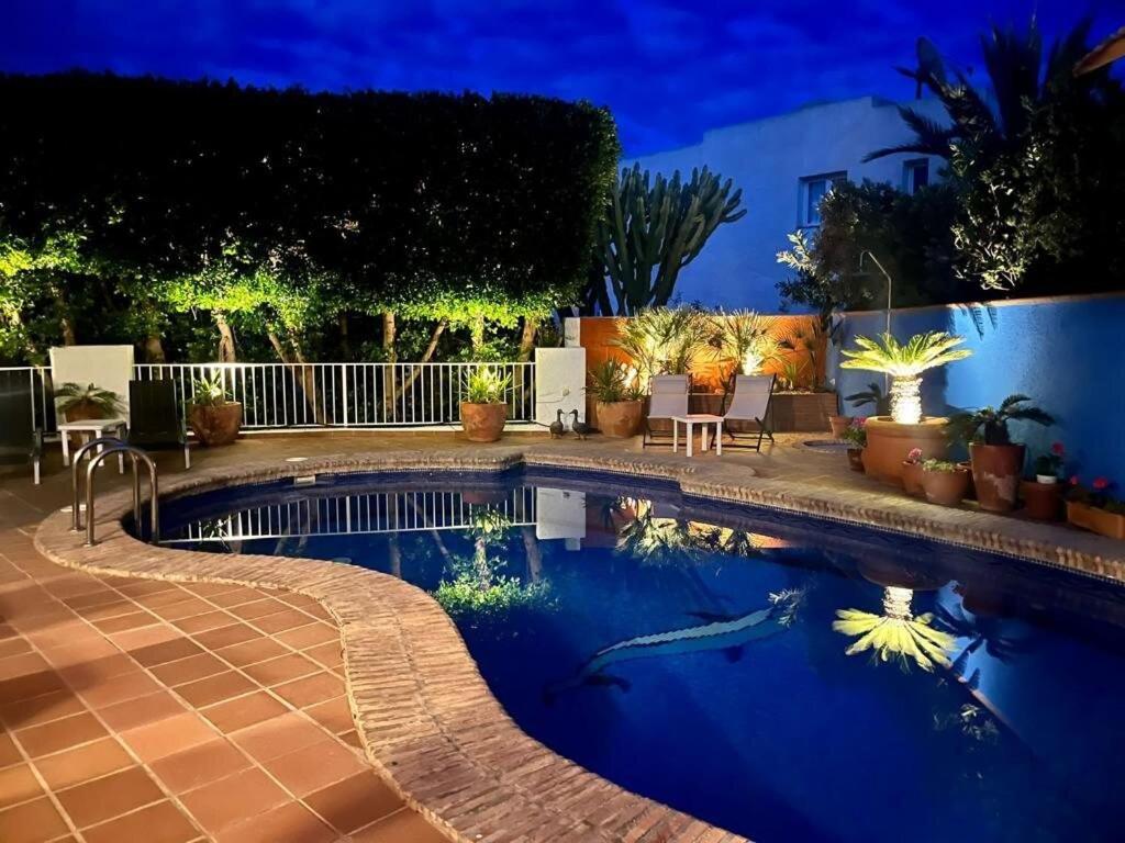 a swimming pool in a backyard at night at Mojacar Villa - Villa Caletta - 4 bedroom - sleeps 8 - R954 in Mojácar