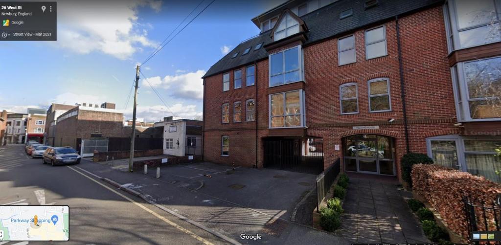 an aerial view of a brick building on a street at Pelican House is an exclusive contemporary development in Newbury