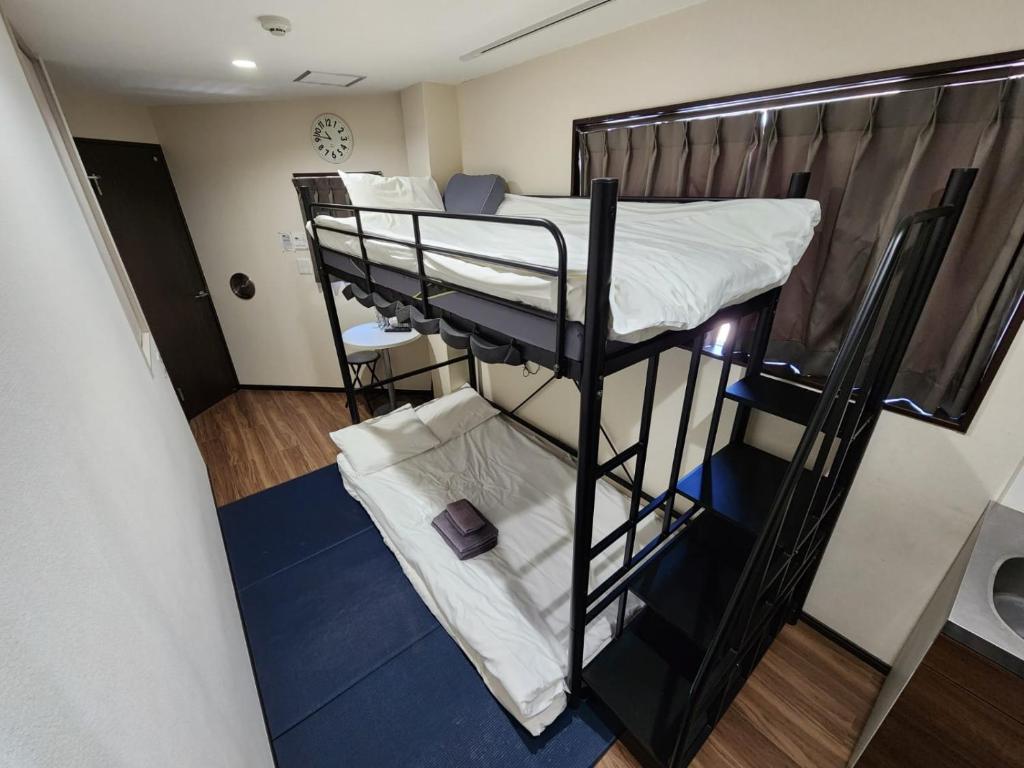 Postel nebo postele na pokoji v ubytování 043AKIHABARA