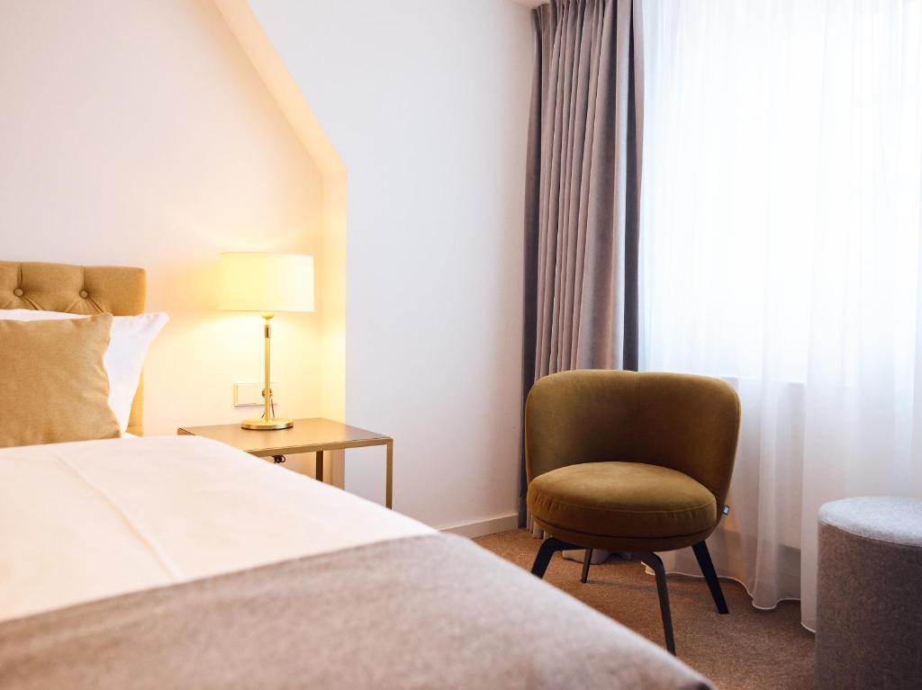 Postel nebo postele na pokoji v ubytování Hotel Lindenufer