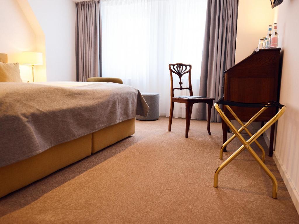 Postel nebo postele na pokoji v ubytování Hotel Lindenufer