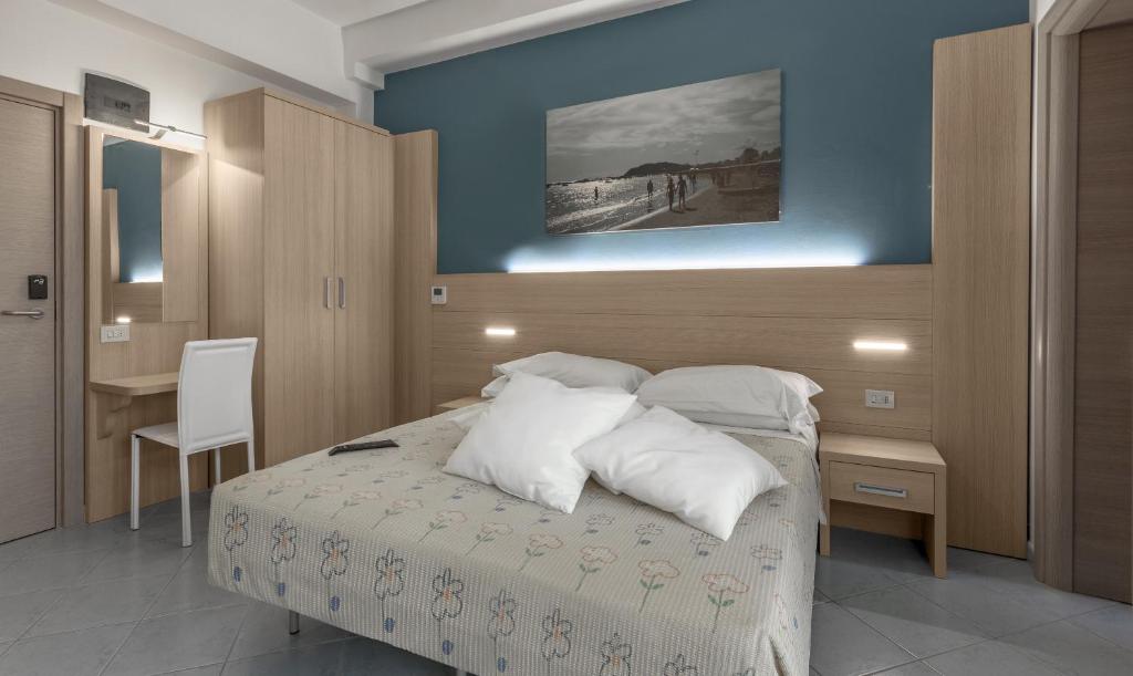Postel nebo postele na pokoji v ubytování Hotel Esperia