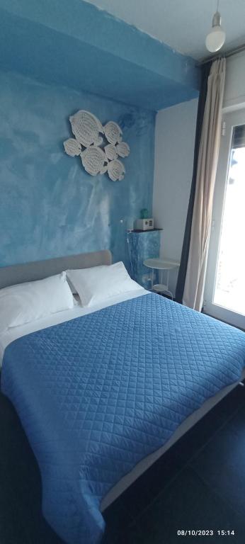 A bed or beds in a room at Affittacamere la Tortuga