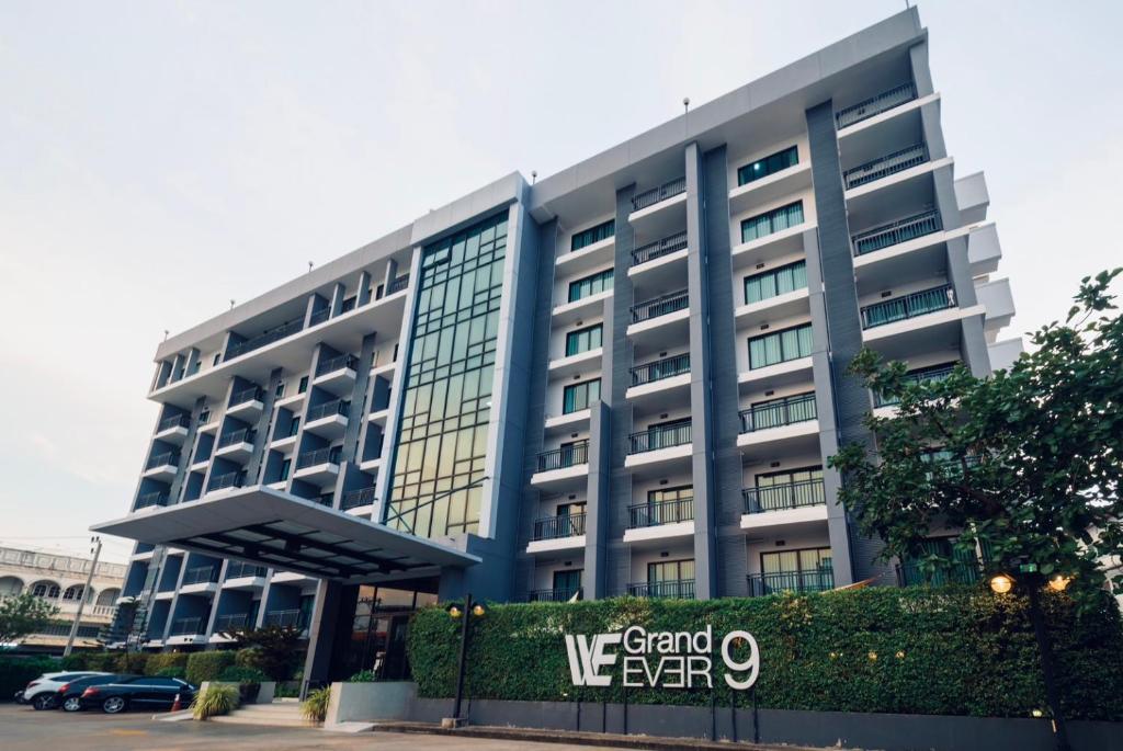 a large building with a sign in front of it at We Grand Ever 9 in Nakhon Ratchasima