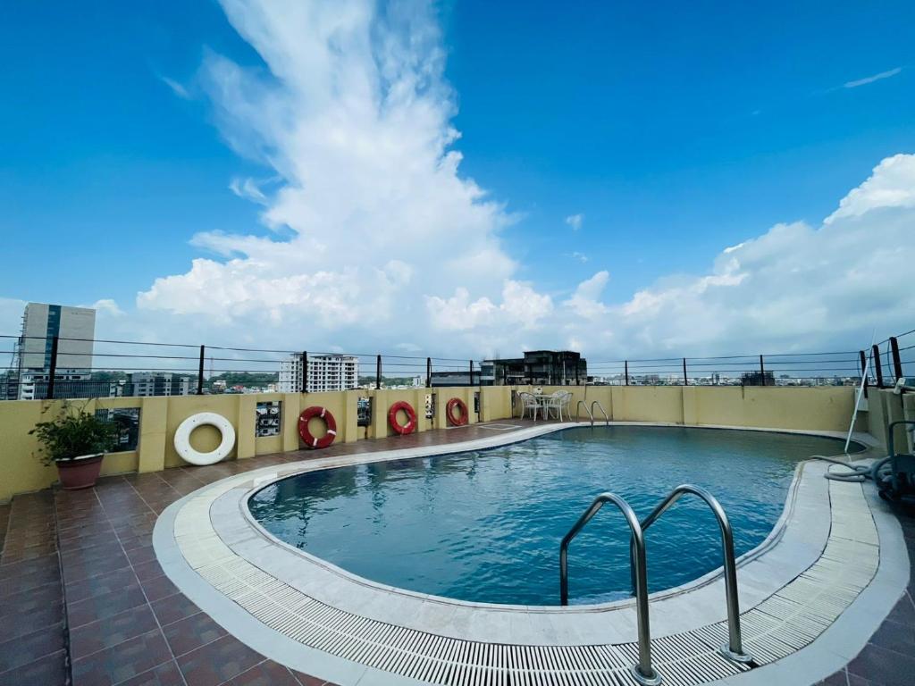 a swimming pool on the roof of a building at Orchid Business Hotel in Chittagong
