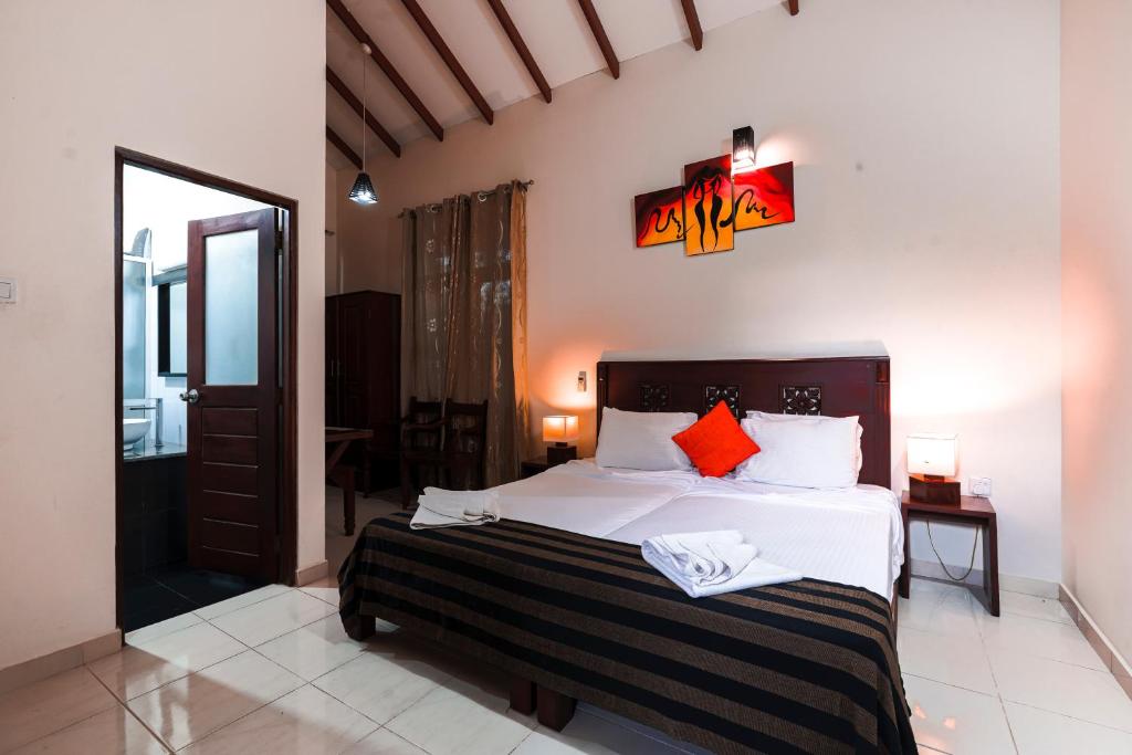Postel nebo postele na pokoji v ubytování Safari Lodge Yala