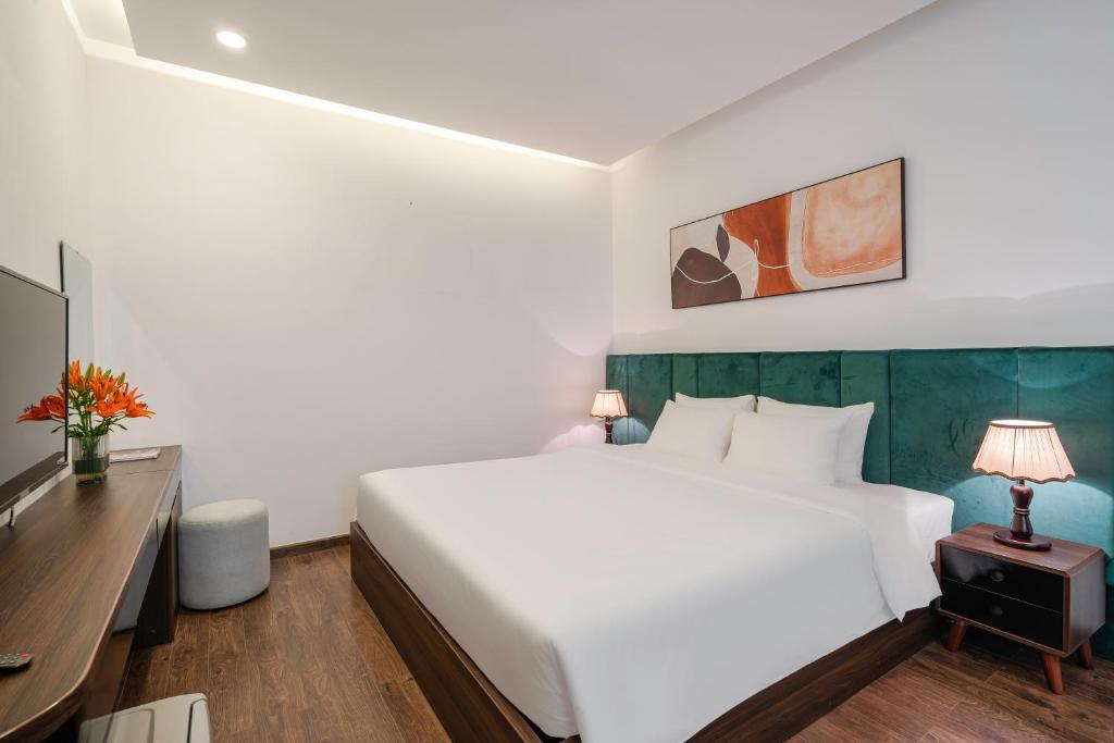 Postel nebo postele na pokoji v ubytování TTR Moonstone Apart Hotel