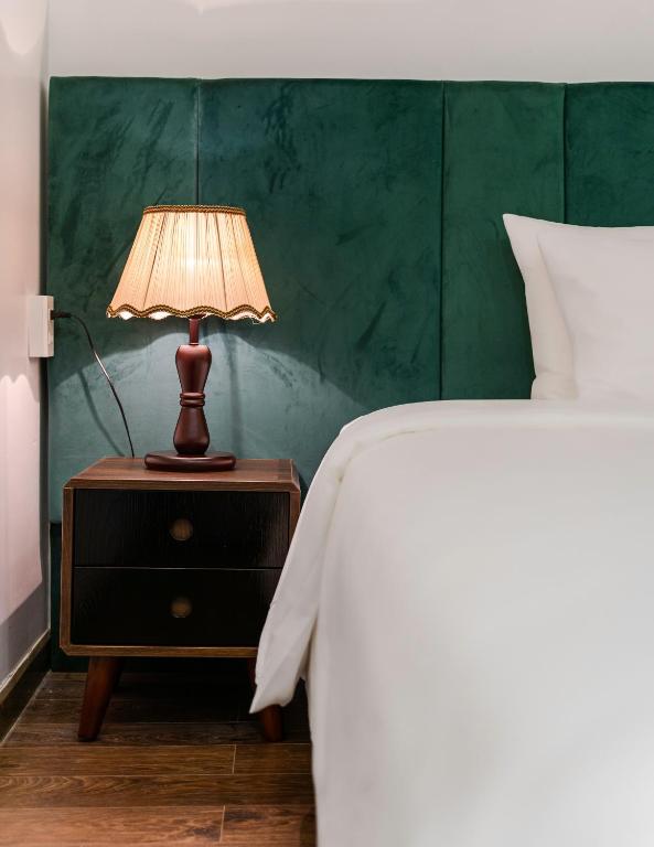 Postel nebo postele na pokoji v ubytování TTR Moonstone Apart Hotel