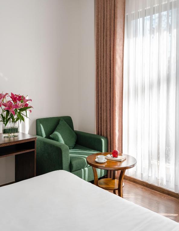 Postel nebo postele na pokoji v ubytování TTR Moonstone Apart Hotel