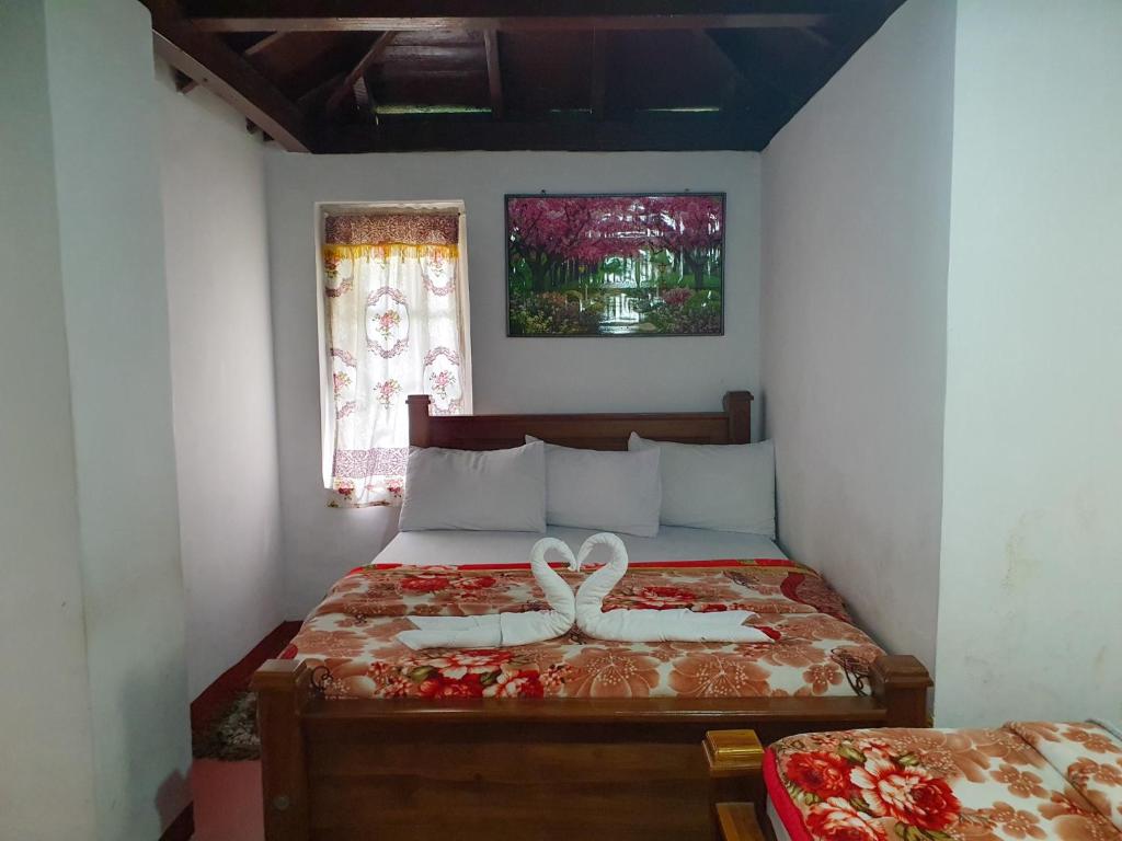 Postel nebo postele na pokoji v ubytování Ruchi House