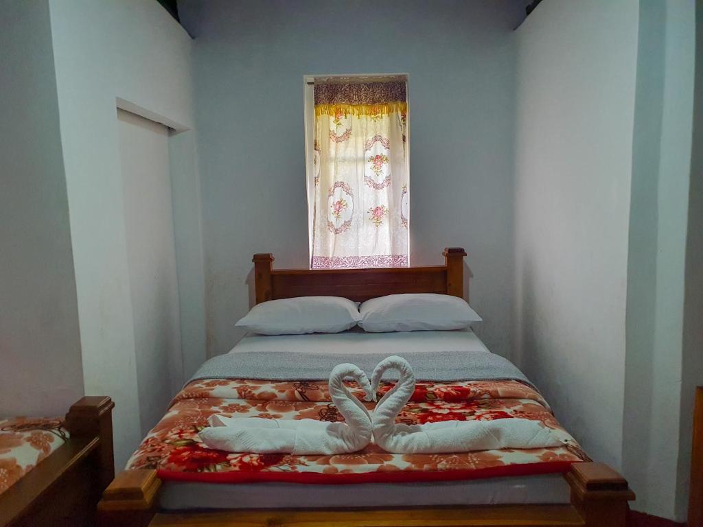 Postel nebo postele na pokoji v ubytování Ruchi House