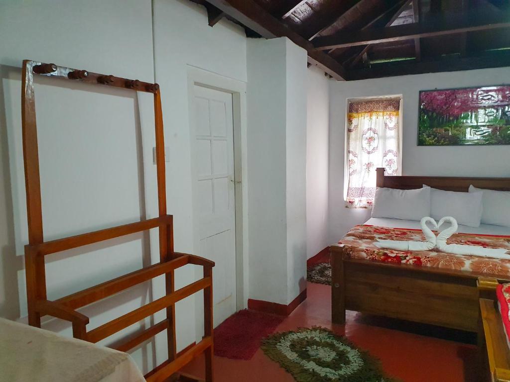 Postel nebo postele na pokoji v ubytování Ruchi House