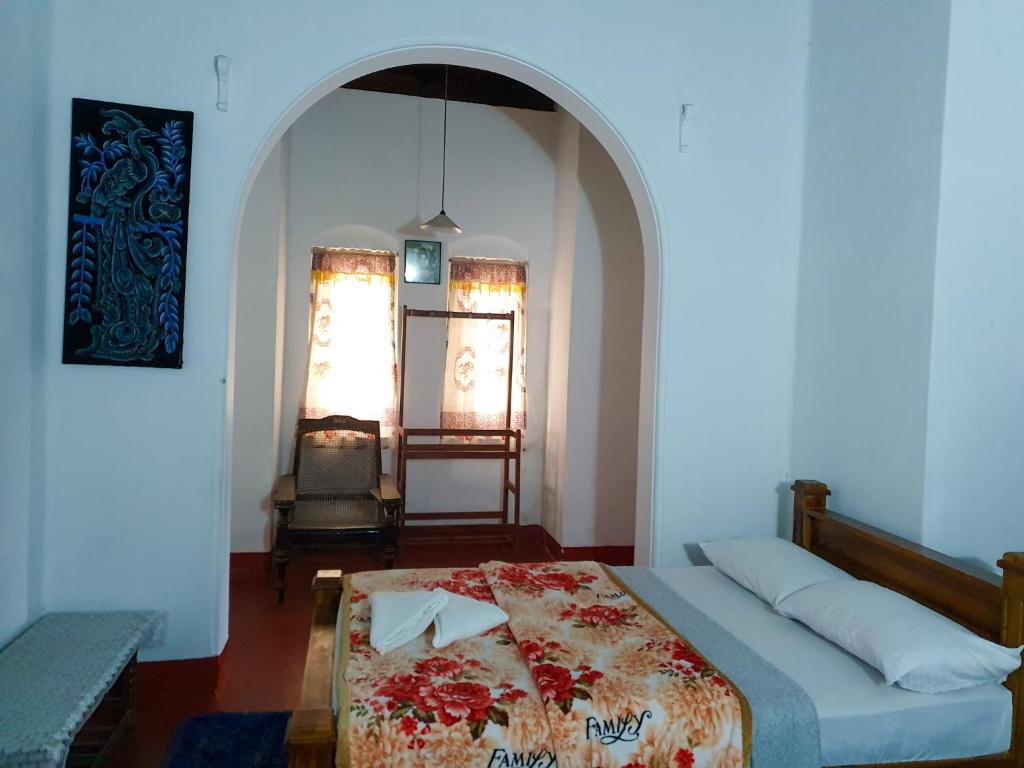 Postel nebo postele na pokoji v ubytování Ruchi House
