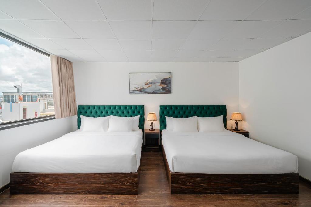 Postel nebo postele na pokoji v ubytování TTR Moonstone Apart Hotel