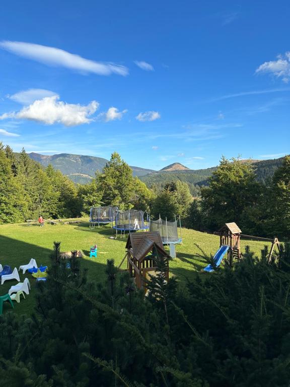 a park with a playground in the middle of a field at Apartmán MATEO Donovaly in Donovaly