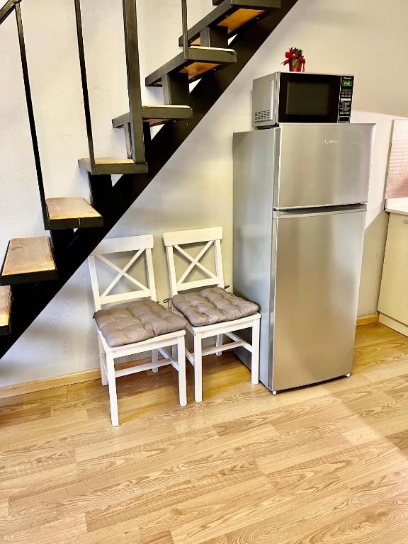 Kuchyň nebo kuchyňský kout v ubytování 3-room Apartment NFT New Gudauri 404