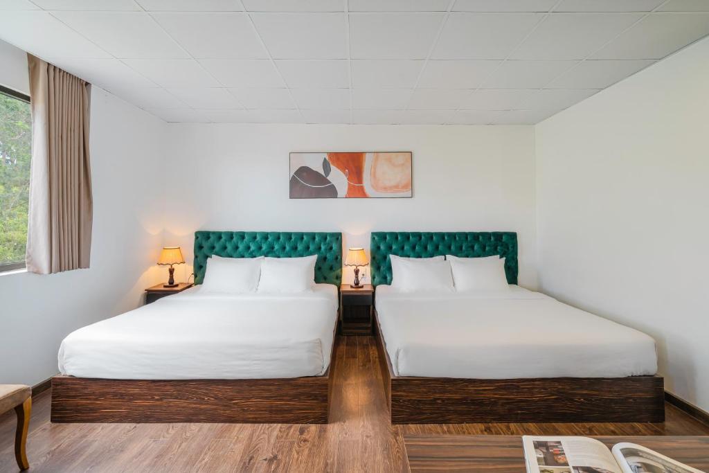 Postel nebo postele na pokoji v ubytování TTR Moonstone Apart Hotel