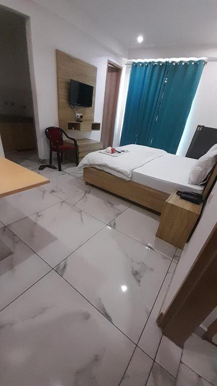 Postel nebo postele na pokoji v ubytování Akshay dream stay