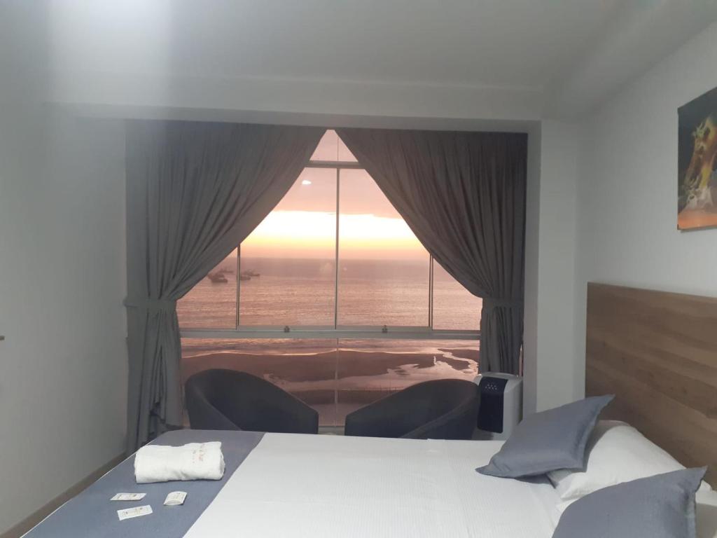 Postel nebo postele na pokoji v ubytování Hotel Terrazas Del Mar
