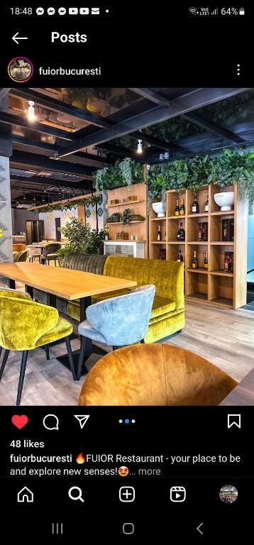 a page of a furniture store with a table and chairs at Private room at Ceausescu's place in Old City Unirii Square in Bucharest