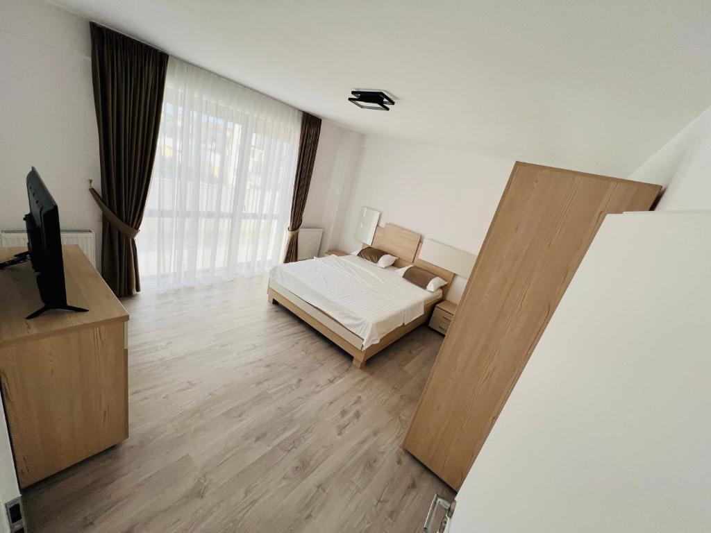 Un pat sau paturi într-o cameră la SNC Residence V