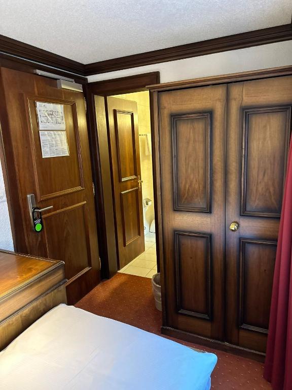 Letto o letti in una camera di Hotel Astoria