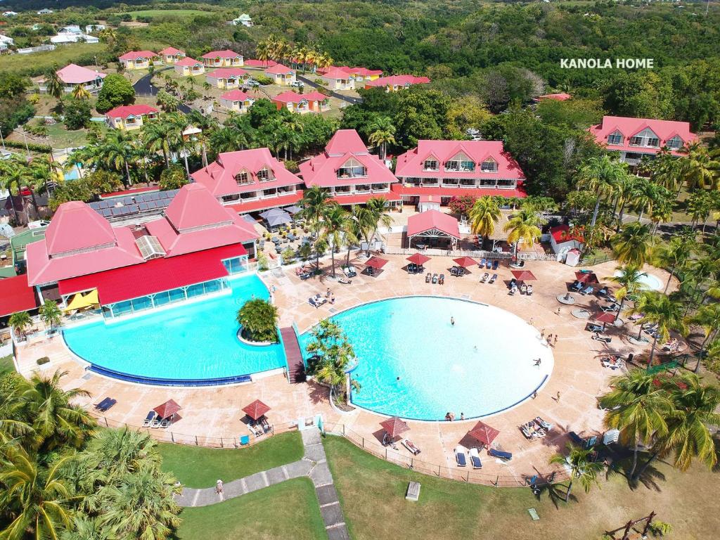 an aerial view of the pool at a resort at KANOLA Home in Sainte-Anne