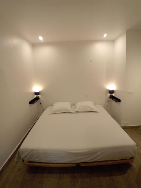 Postel nebo postele na pokoji v ubytování 11 Rue Vauban