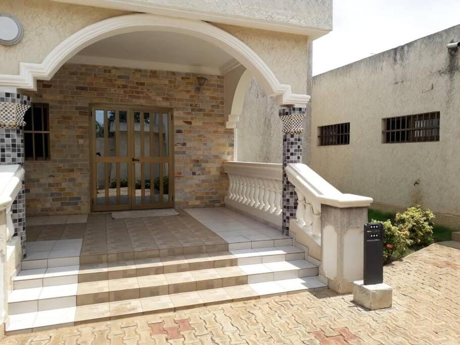 an entrance to a building with a glass door at Villa AV Lomé in Lomé