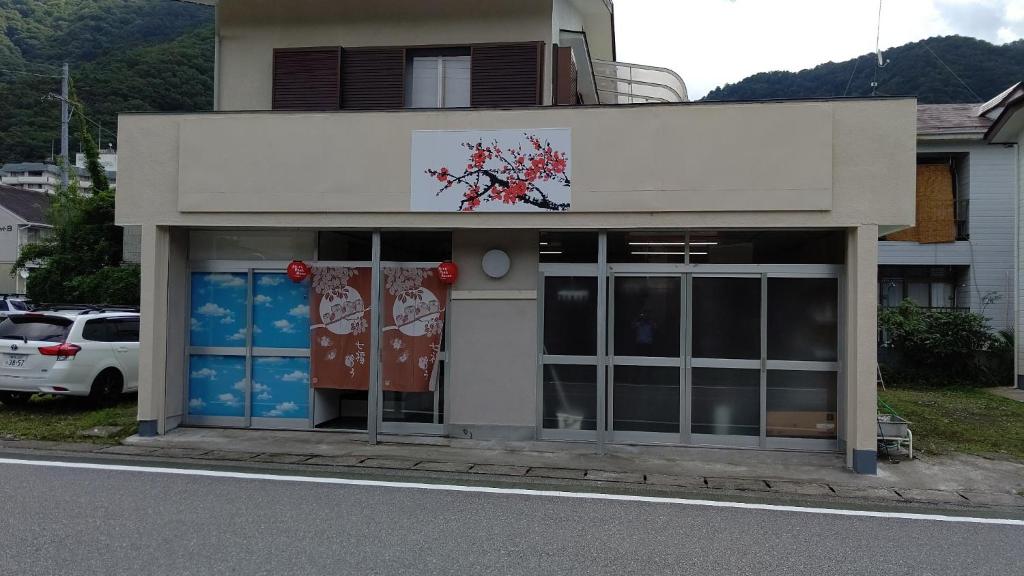 a building with doors open on the side of a street at Yagisawa Home - Vacation STAY 67831v in Nikko