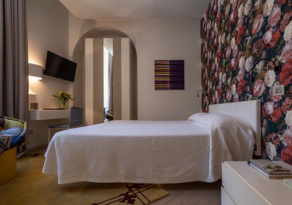 Postel nebo postele na pokoji v ubytování Hotel Residenza la Ceramica