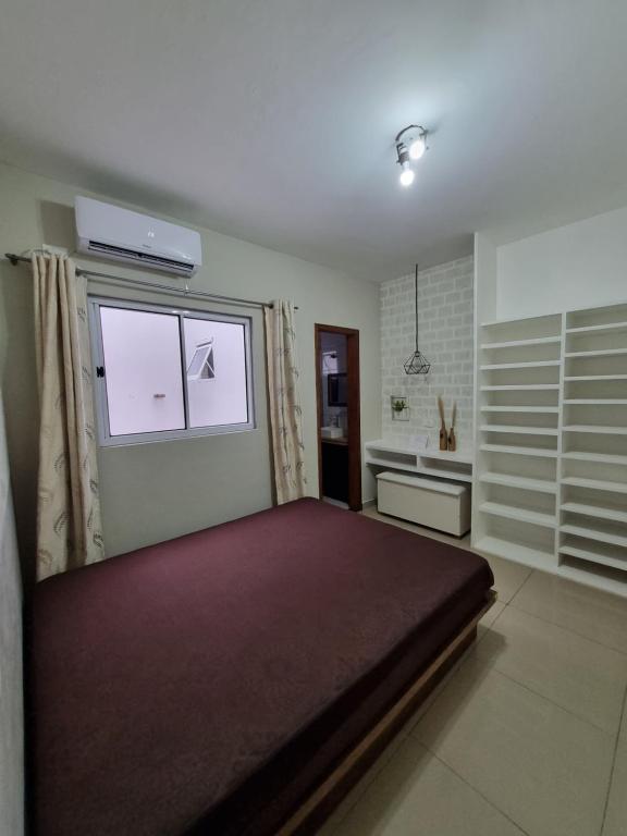 Llit o llits en una habitació de Casa com piscina em Guaratuba PR