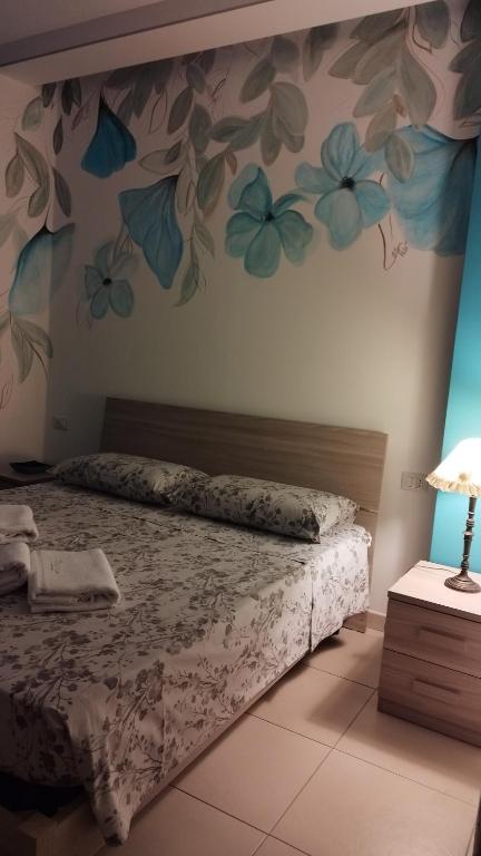 A bed or beds in a room at Massanè Casa Vacanza