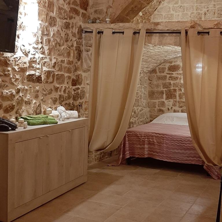 Postel nebo postele na pokoji v ubytování Dimora Cleó