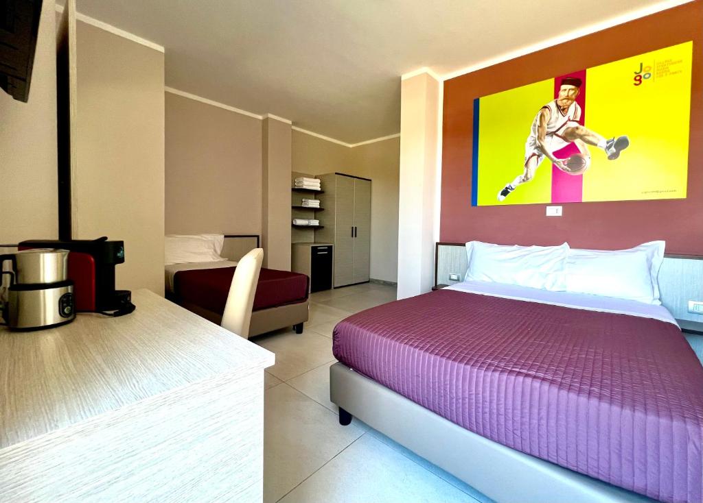 Postel nebo postele na pokoji v ubytování Jogo Rooms