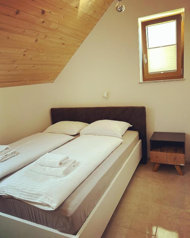 Postel nebo postele na pokoji v ubytování ALPS Apartments