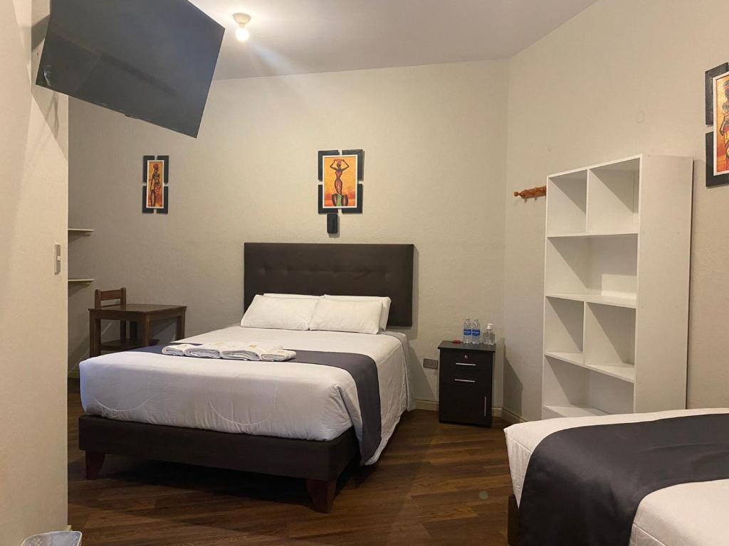 Postel nebo postele na pokoji v ubytování Hostal Virreinal AQP