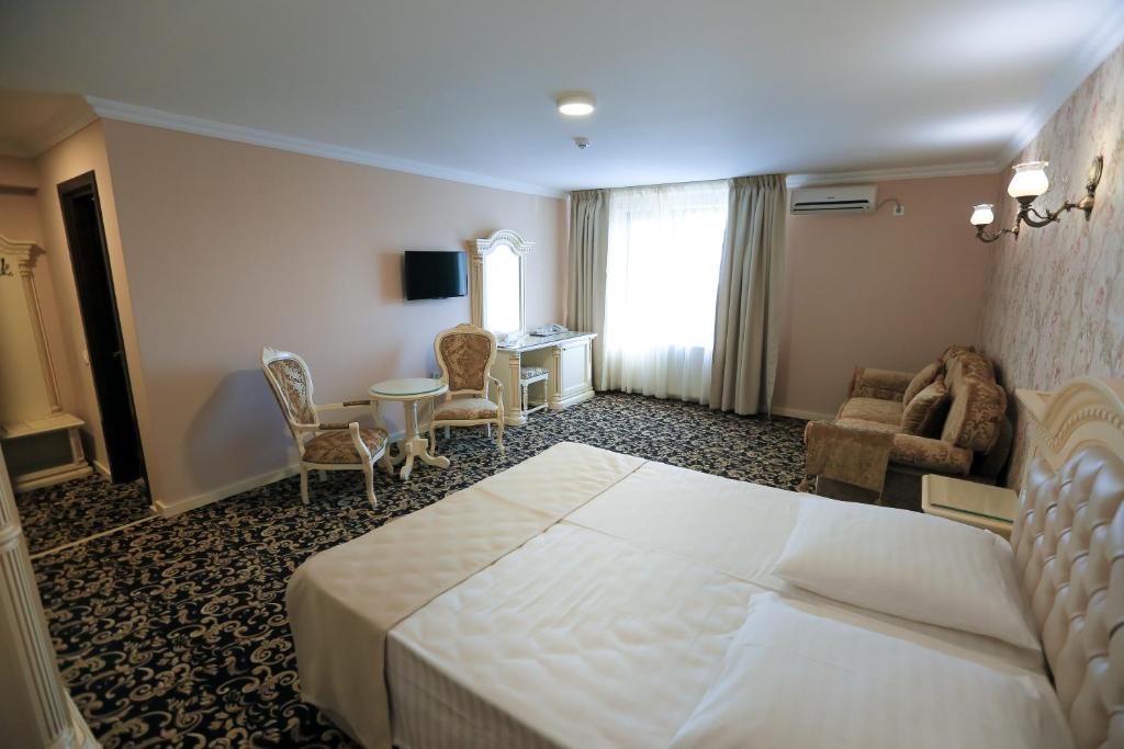 Postel nebo postele na pokoji v ubytování Hotel Orient Braila