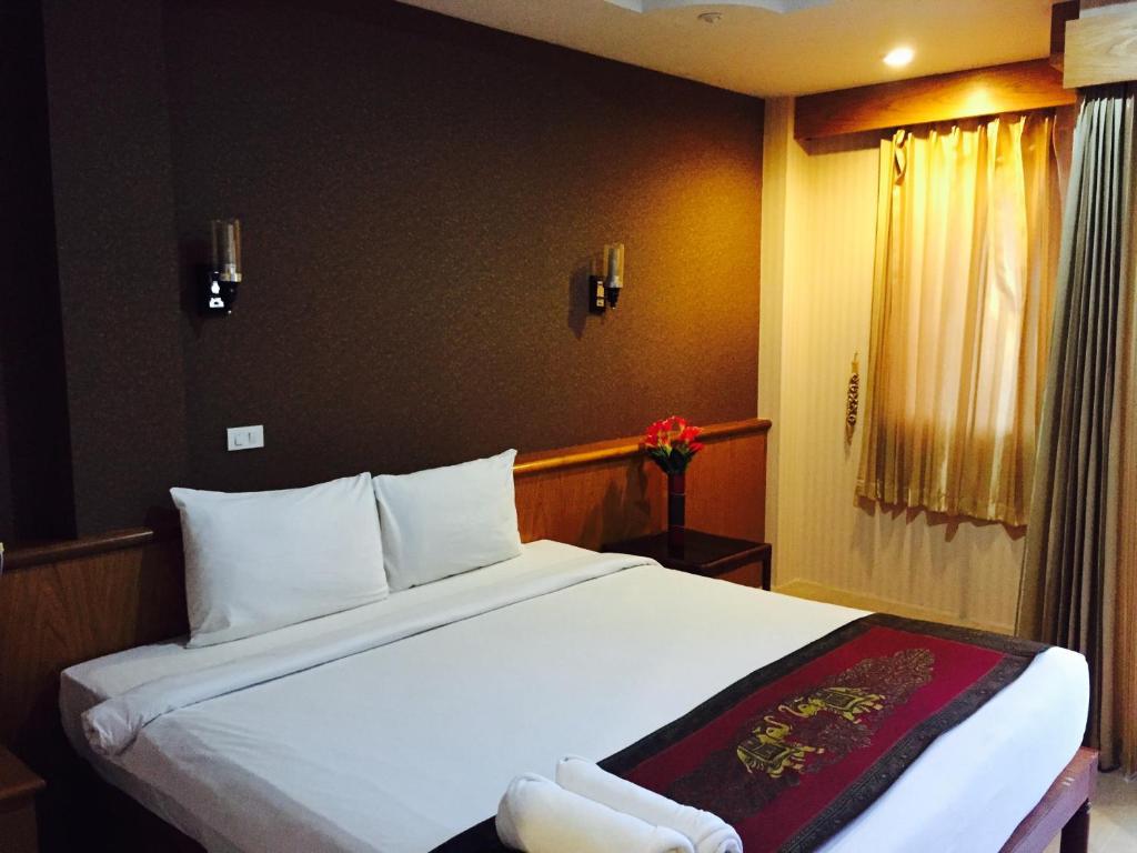 Postel nebo postele na pokoji v ubytování Natural Samui Hotel
