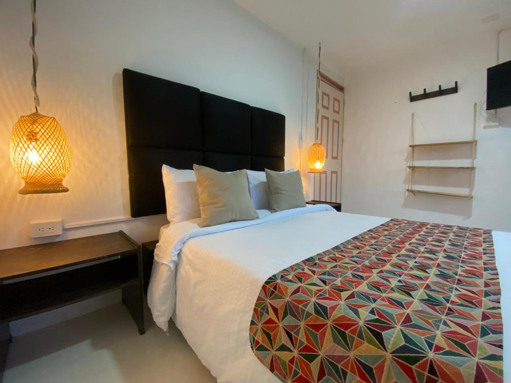 Voodi või voodid majutusasutuse Mahalo Hostel toas