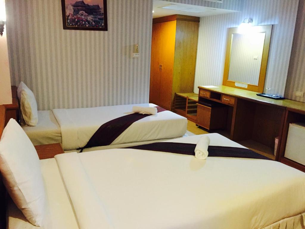 Postel nebo postele na pokoji v ubytování Natural Samui Hotel